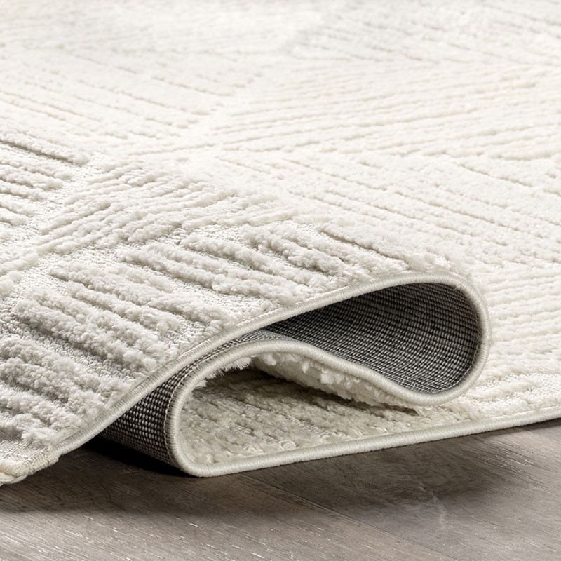 Kerry Textured Geometric Tasseled Area Rug